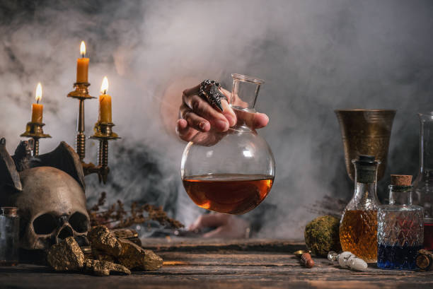 Alchemist is working by his magic table Alchemist is working by his magic table